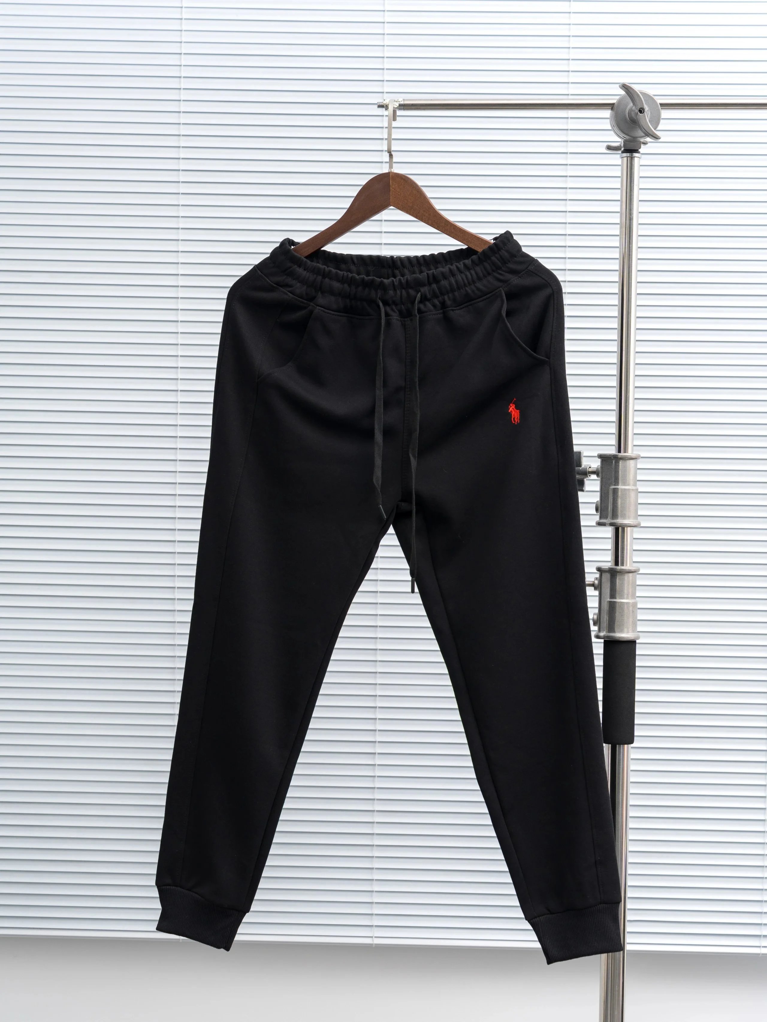 Black and red marked pants