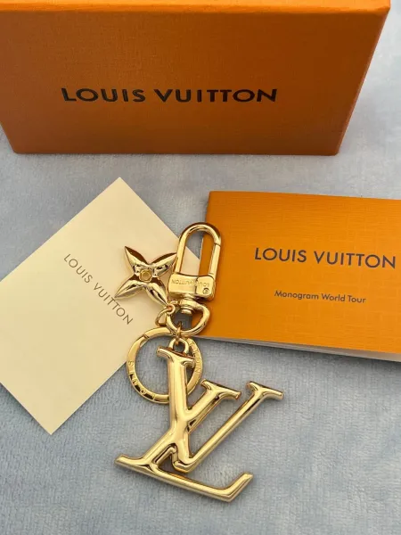 Louis Vuitton Monogram World Tour LV Logo Keychain Gold Accessories - 1