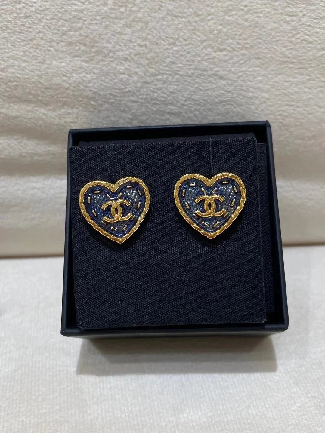 Chanel Heart-shaped CC logo earrings with denim texture