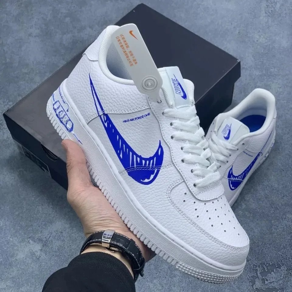 Nike Sneakers Air Force 1 Low with skeletal Swoosh detail — blue and white graffiti