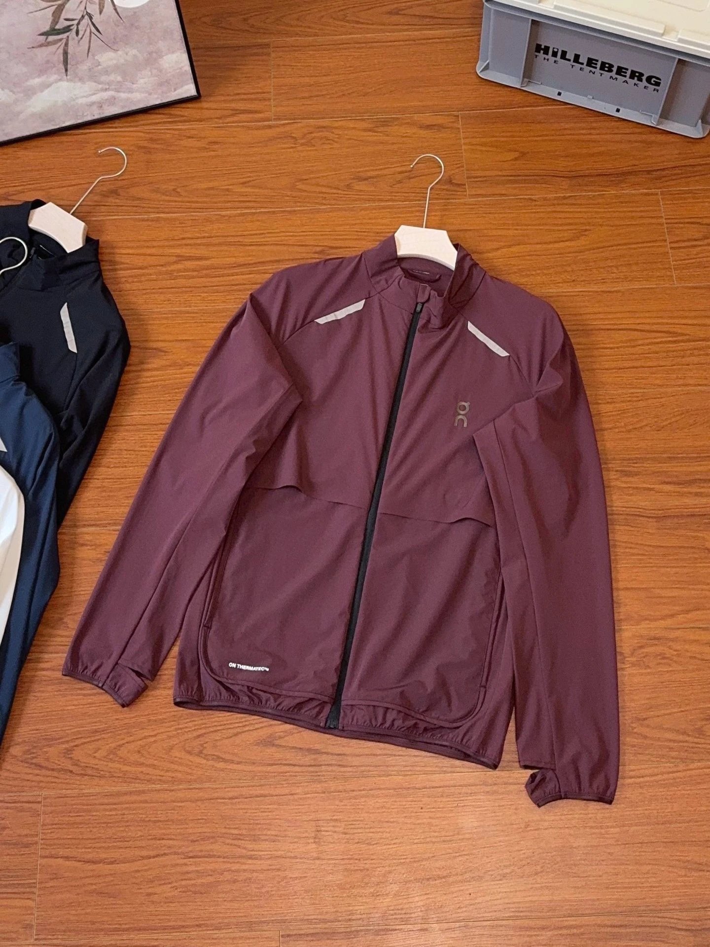 On Jackets Lightweight zip-front running jacket with reflective shoulder trim — Wine red