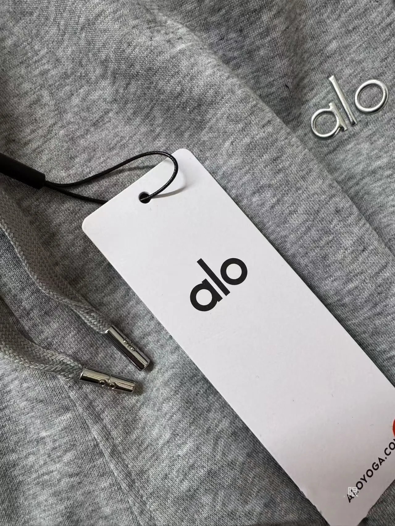 Alo Tracksuits Hooded sweatshirt and straight-leg sweatpants set — Wear the original logo cord tip on the hat strap.