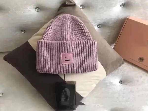 Comme des Garçons Play Pink Ribbed Beanie with Smiley Patch - 1