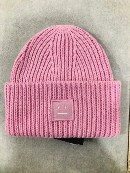 Comme des Garçons Play Pink Ribbed Beanie with Smiley Patch - 1