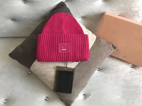 Comme des Garçons Play Pink Ribbed Beanie with Smiley Face Patch - 1