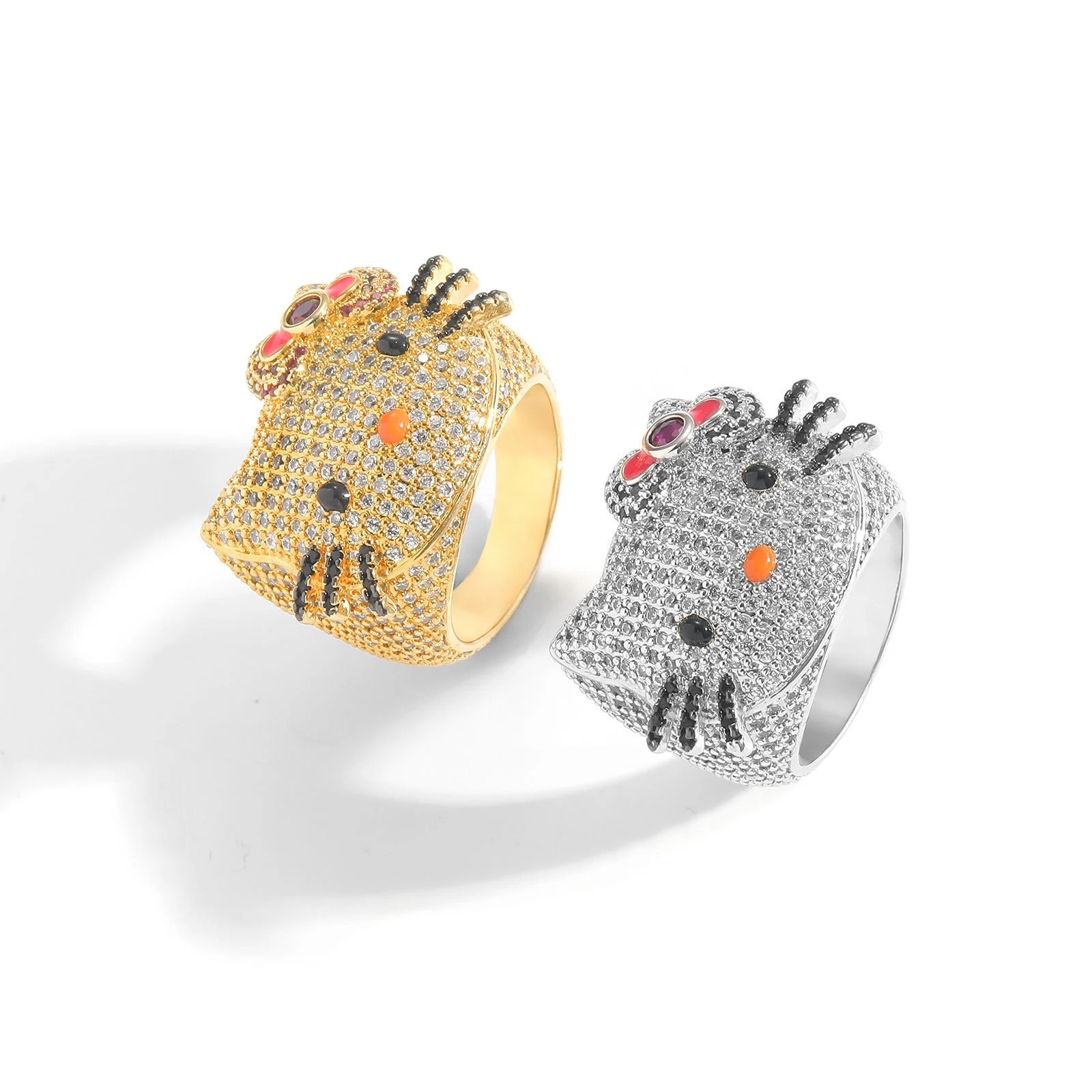 A Ring With A Tiny Inlaid Zircon Gemstone Cat