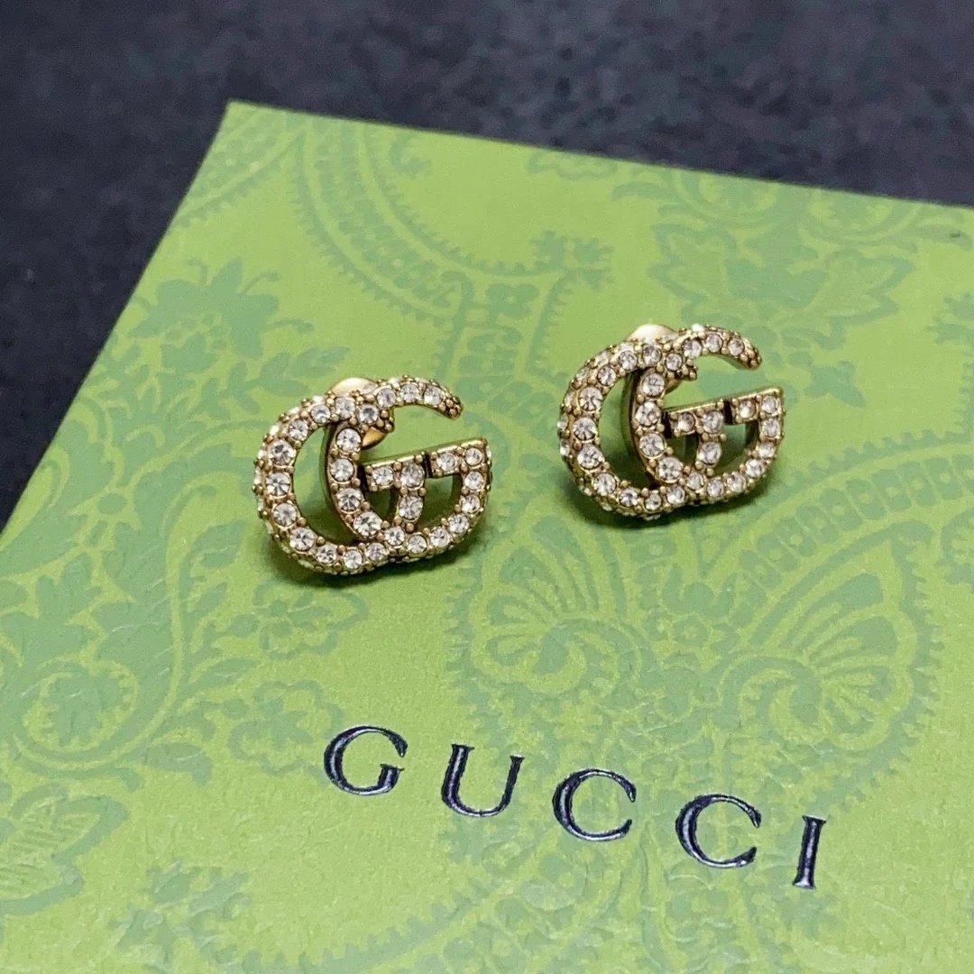 Gucci GG Pearl Gold Tone Stud Earrings