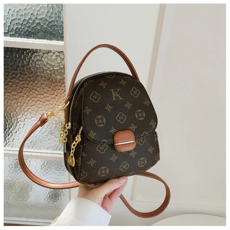 Design Mini Monogram-Print Crossbody Backpack Brown Crossbody Bags