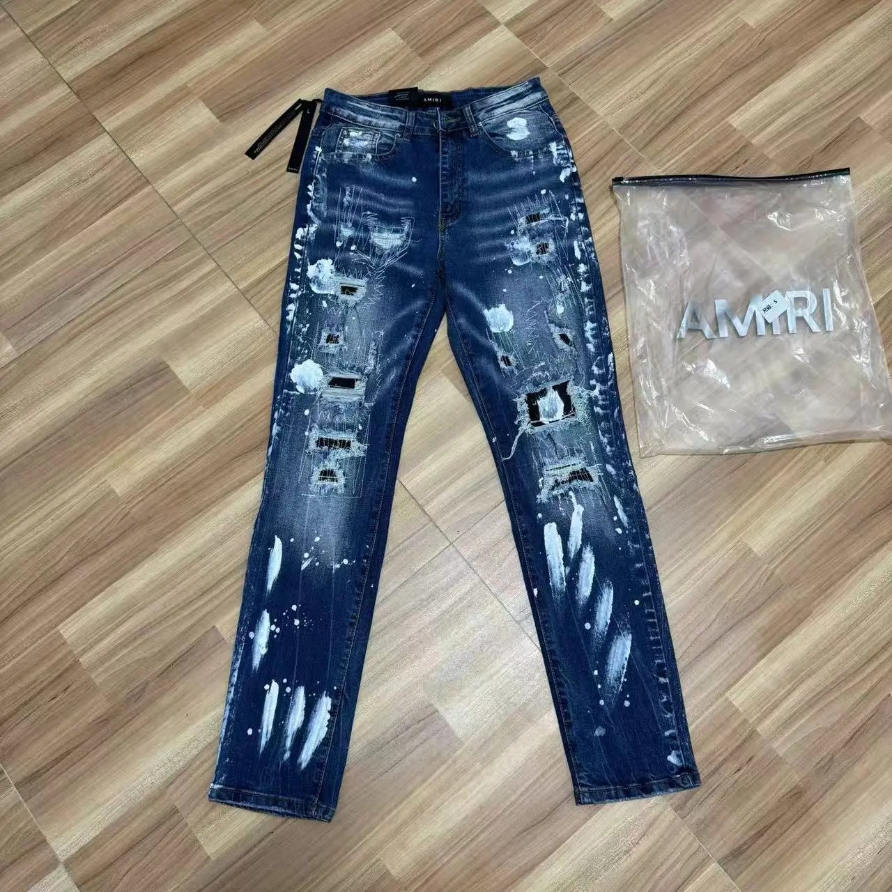Amiri Paint Splatter Distressed Slim Fit Jeans Blue