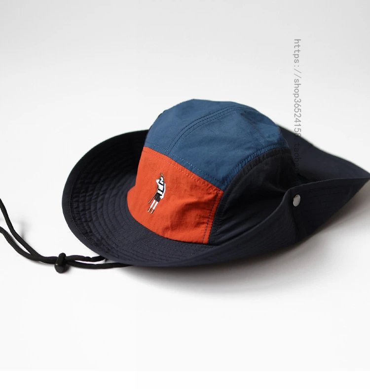 Design Bucket Hat Navy Blue and Orange Panel with Embroidered Figure