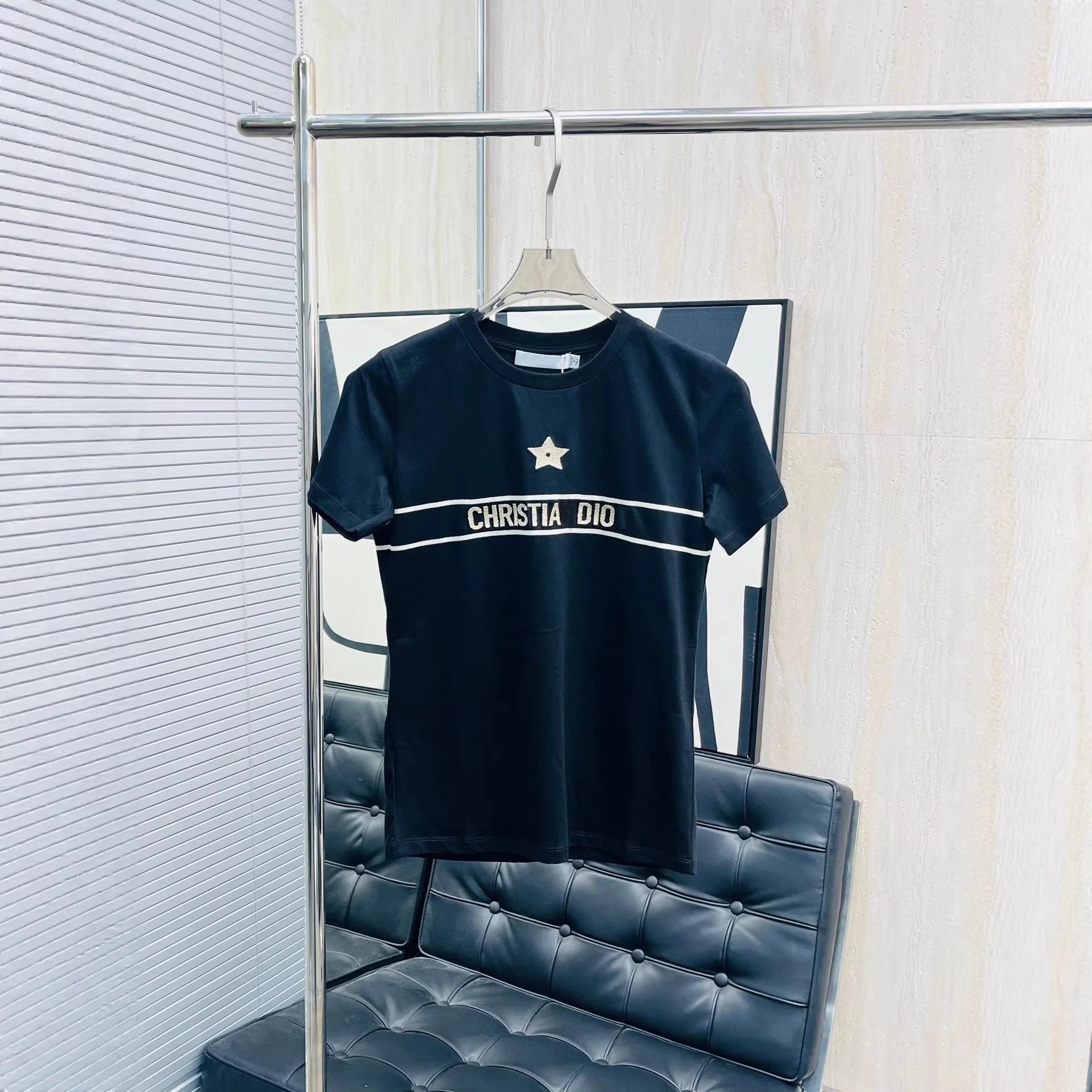 Christia Dior Black Graphic Tee Grey Pleated Skirt Casual Outfit