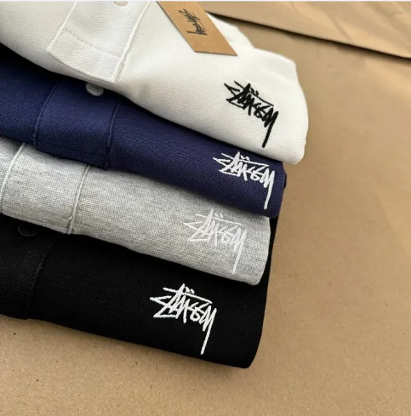 Stussy Classic Logo Polo Shirt in White, Gray, Black, and Navy - 11