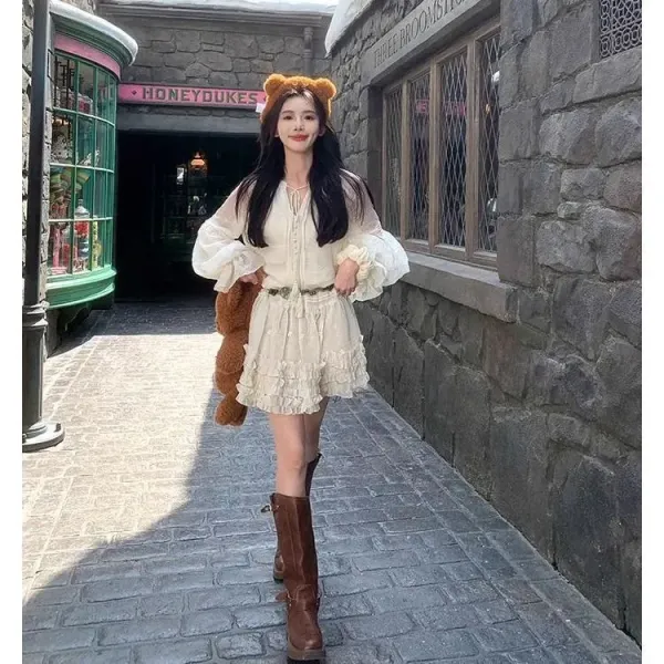 Design White Ruffled Smocked Dress with Bell Sleeves and Brown Leather Boots - 18