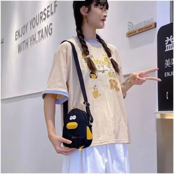 Design Snoopy x Unknown Brand Penguin Crossbody Bag Black Yellow Crossbody Bags - 1