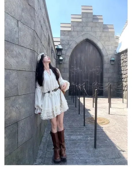 Design White Ruffled Smocked Dress with Bell Sleeves and Brown Leather Boots - 12