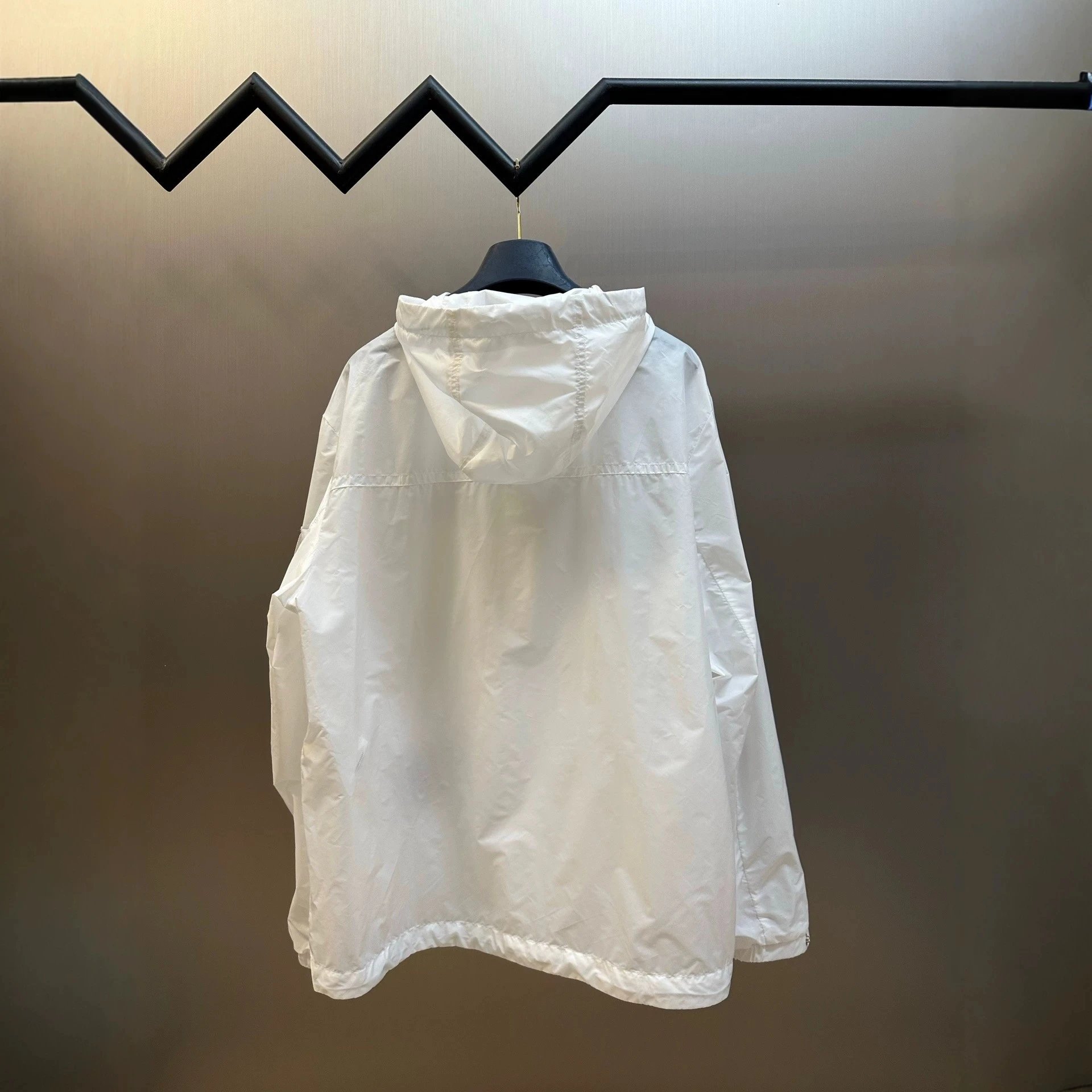White Hooded Windbreaker Jacket With Embroidered Logo And Snap Pocket
