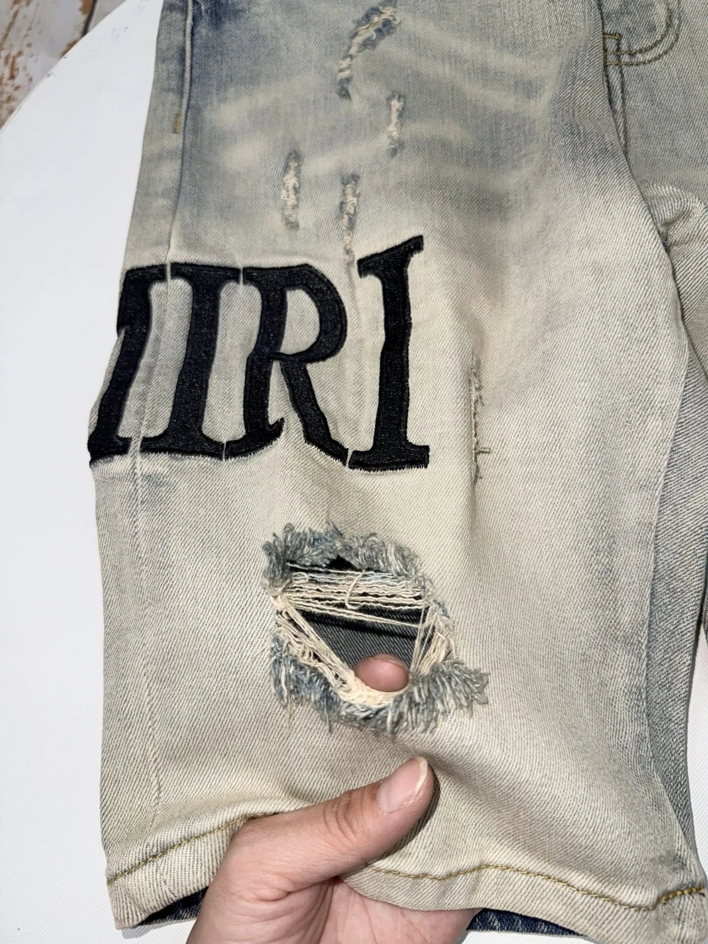 Amiri Distressed Logo Print Slim Fit Jeans Light Wash - 10