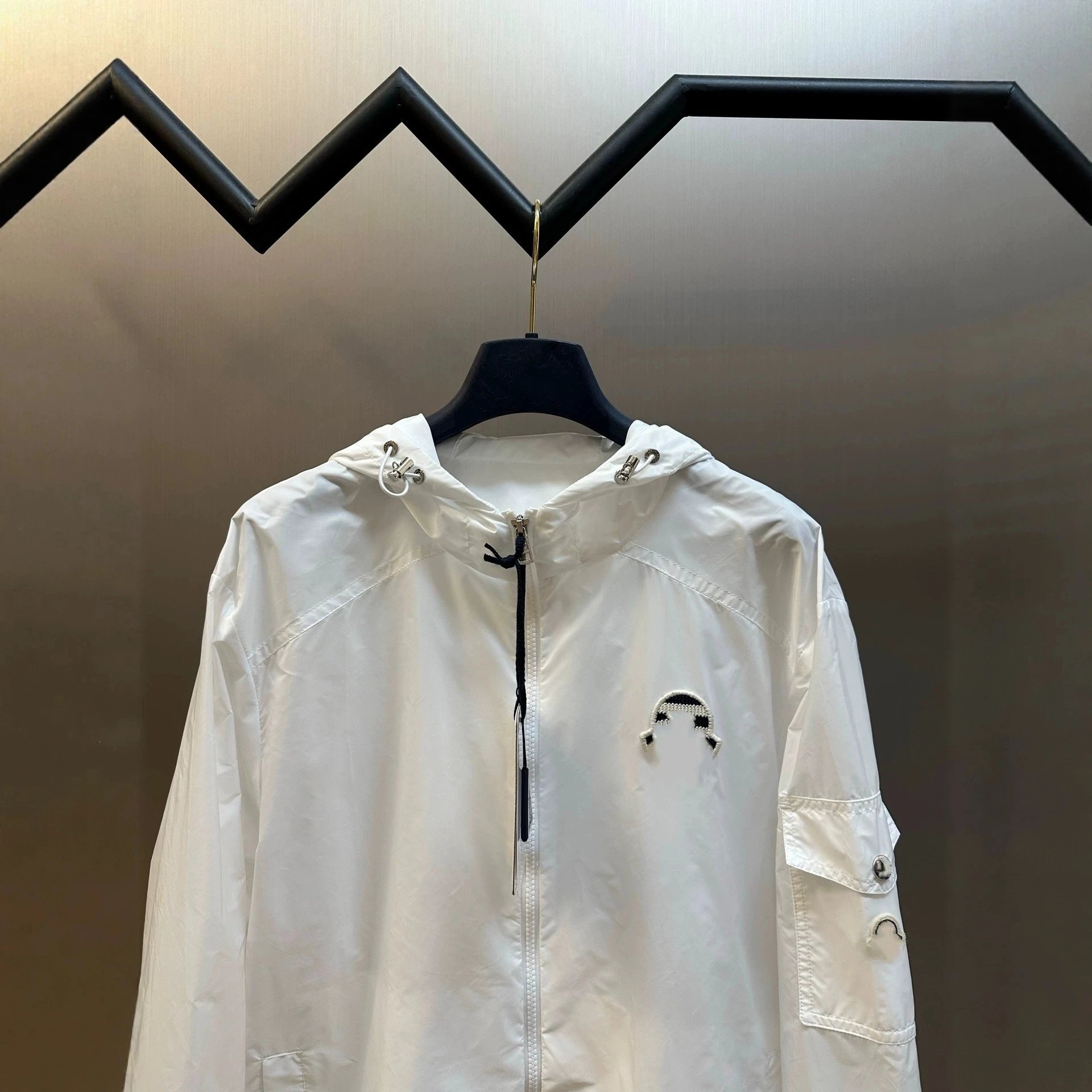 White Hooded Windbreaker Jacket With Embroidered Logo And Snap Pocket