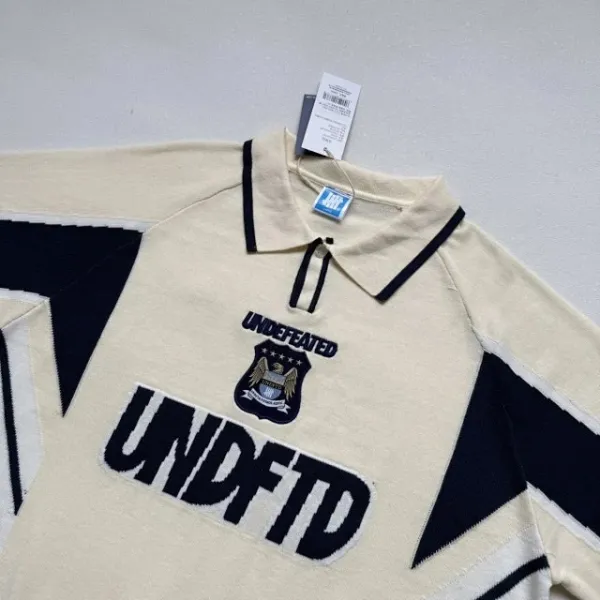 Design Undefeated x Manchester City Polo Shirt Black and Beige Polo Shirt - 23