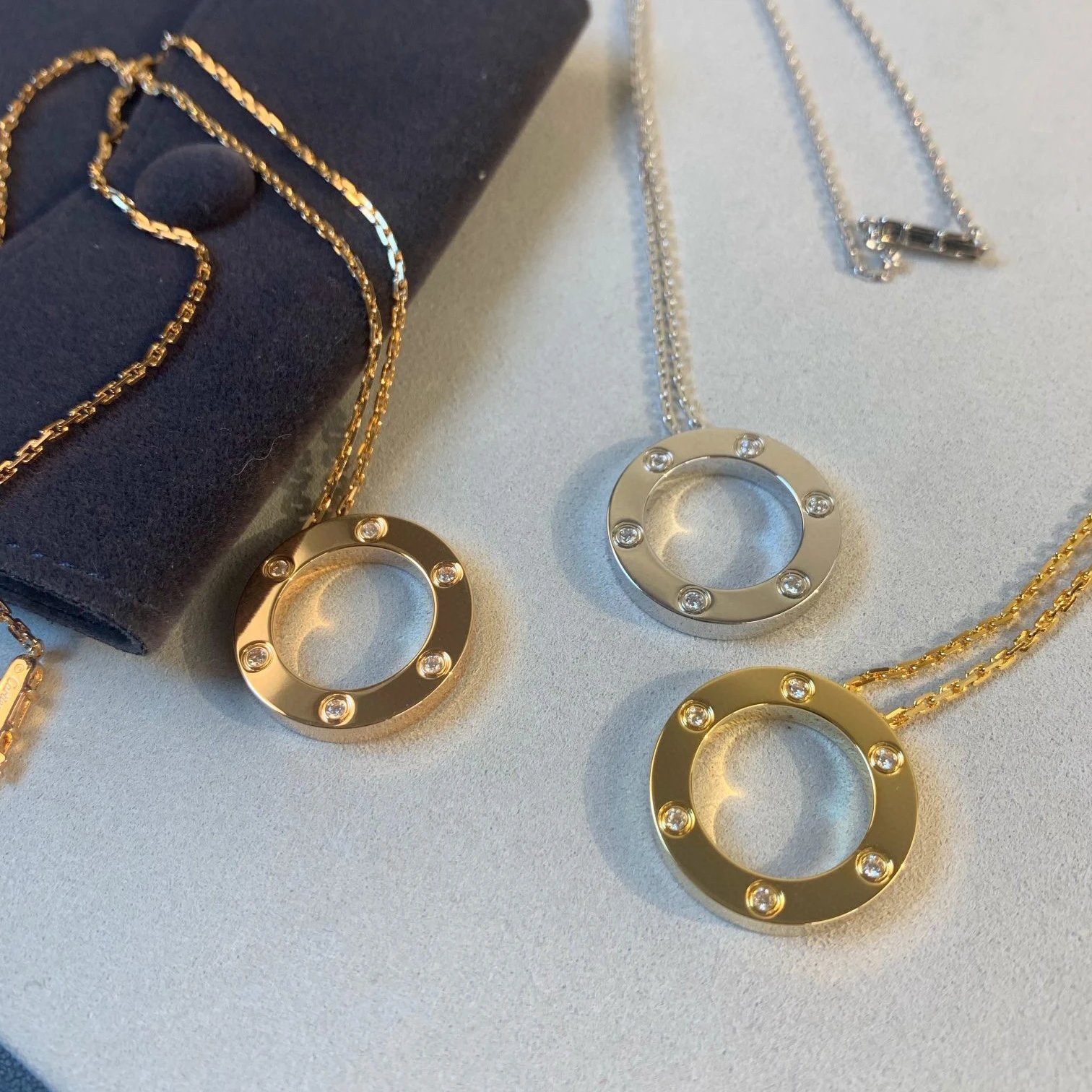 Cartier Love Pendant Necklace in Yellow Gold, White Gold, and Rose Gold with Diamonds Jewelry