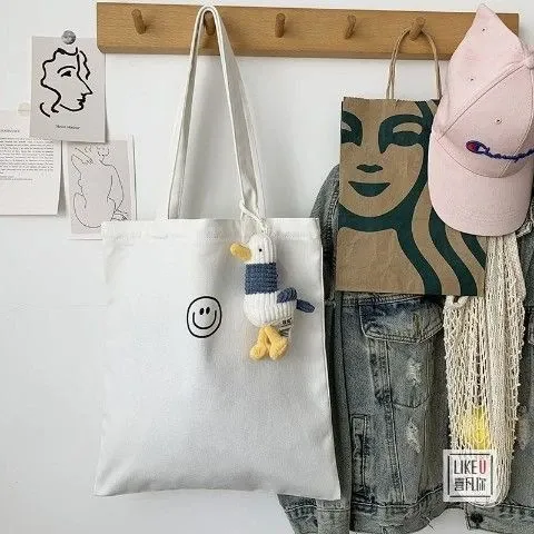 Design Starbucks Paper Tote Bag with Green Logo + White Canvas Tote with Smiley Face and Duck Charm Tote Bag - 1