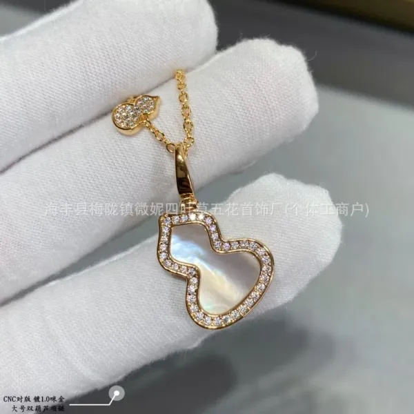 Design Double Gourd Pendant Necklace with Mother-of-Pearl and Cubic Zirconia in Gold-Tone Jewelry - 1