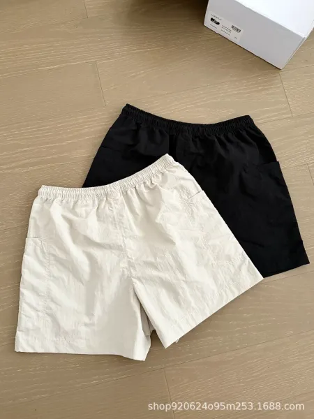 Miu Miu Logo-Embroidered Drawstring Shorts Beige and Black - 5