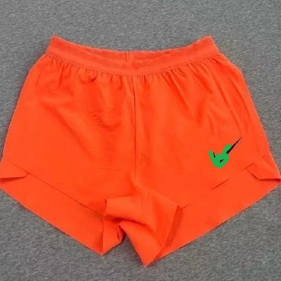 Design Running Shorts Orange with Green Logo