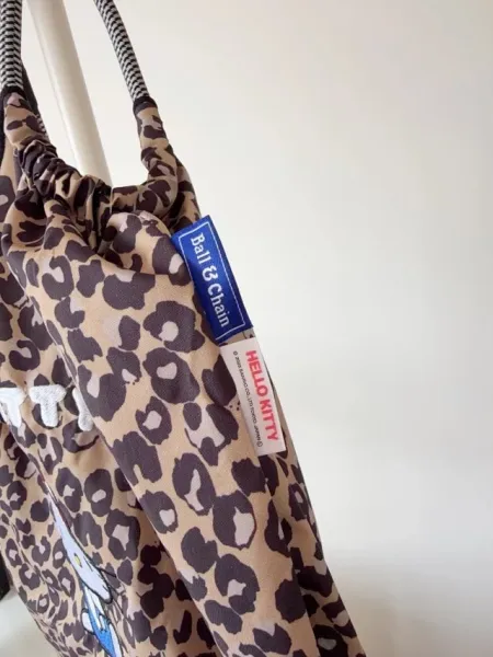 Hello Kitty Leopard Print Tote Bag with Embroidered Character and Charm - 25