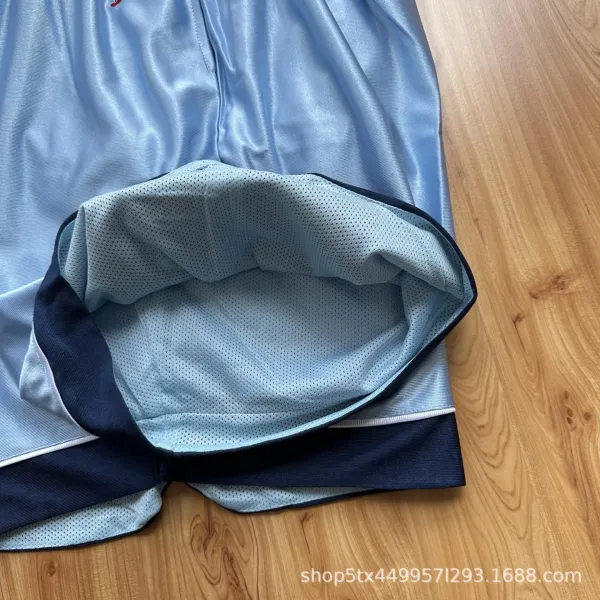Design Basketball Shorts Light Blue with Navy and Red Numbering - 22