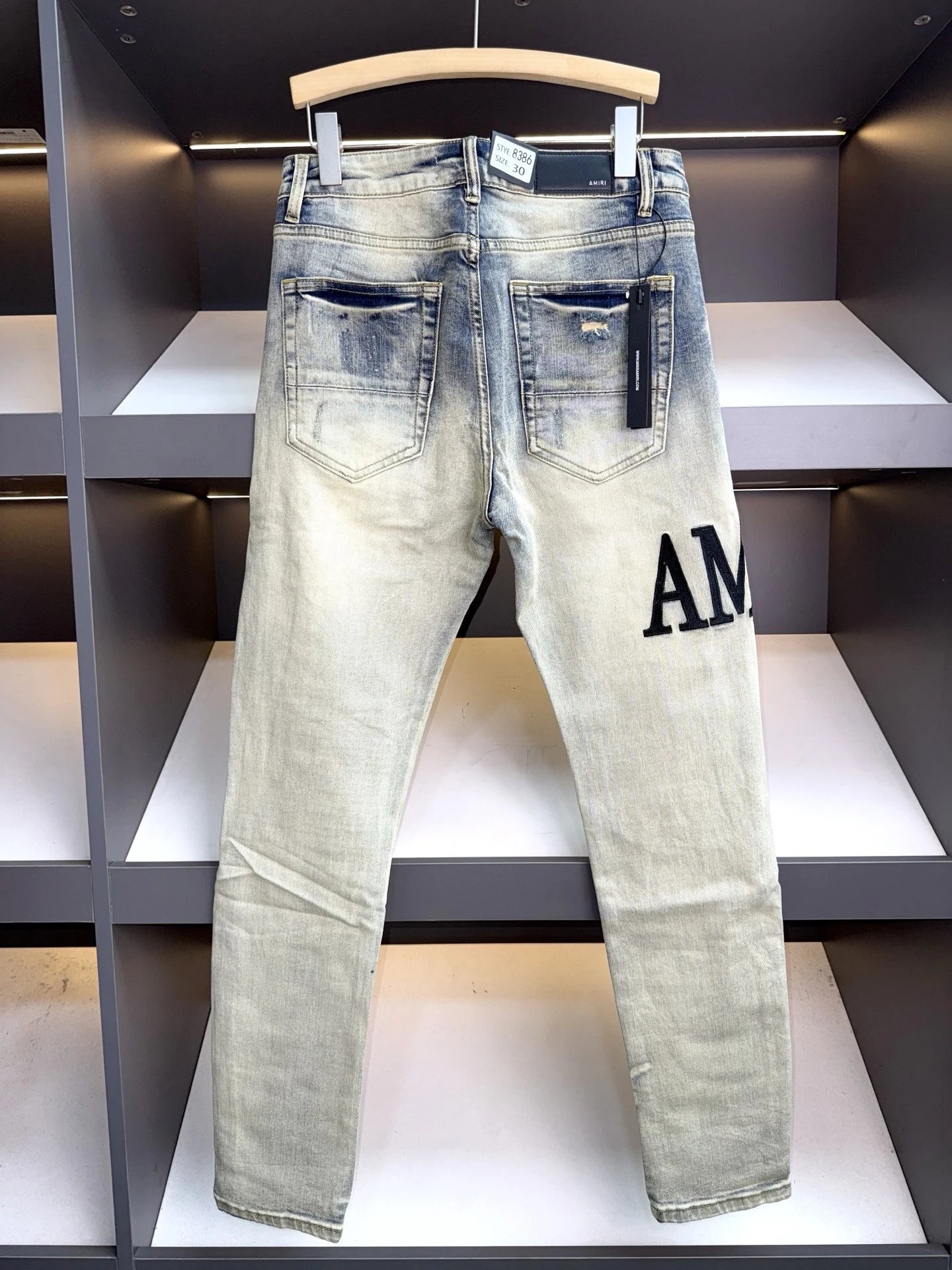 Amiri Distressed Logo Print Slim Fit Jeans Light Wash - 12