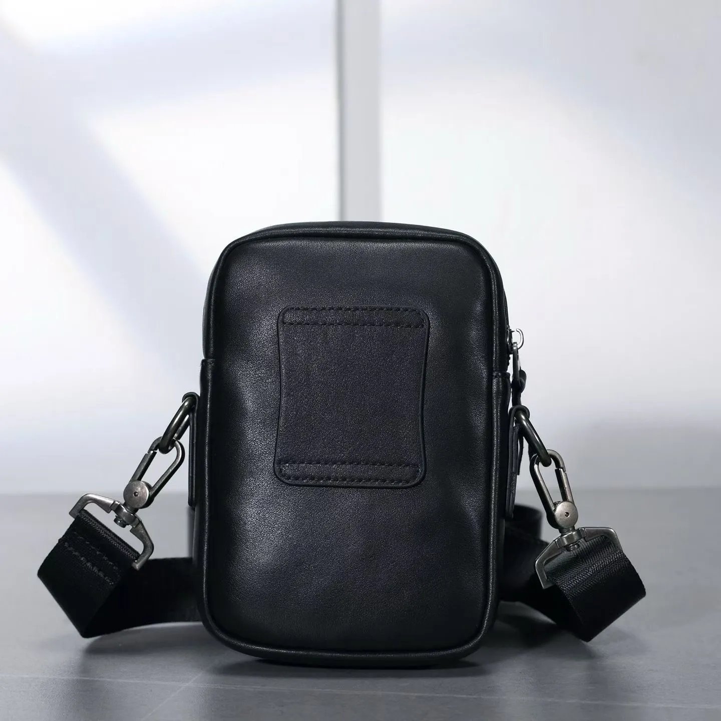 Black Leather Crossbody Bag With Zipper Pocket And Metal Hardware