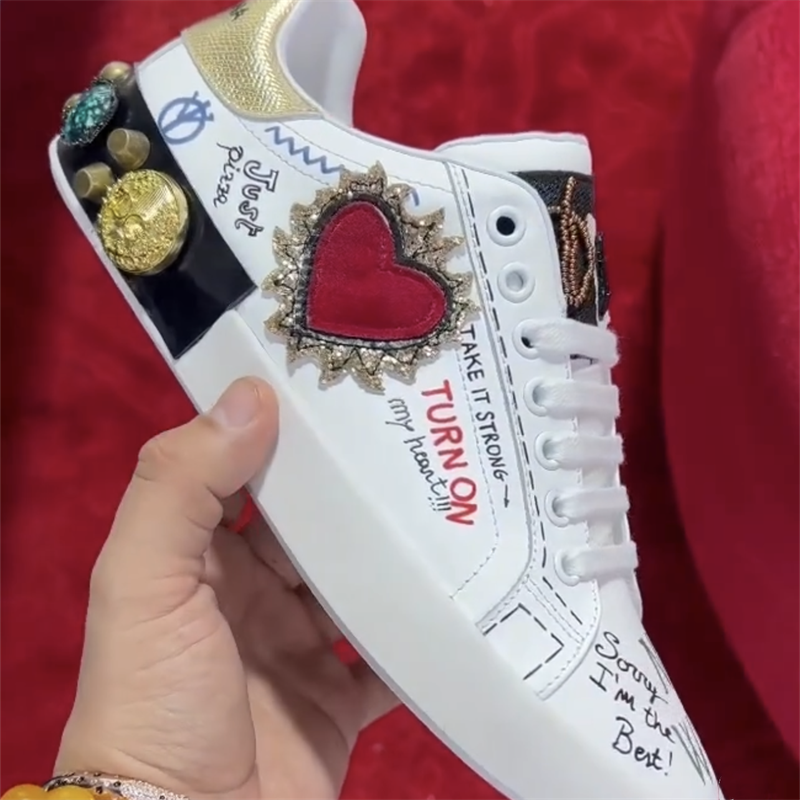 Dolce & Gabbana Sneakers Graffiti-print embellished low-top — 1
