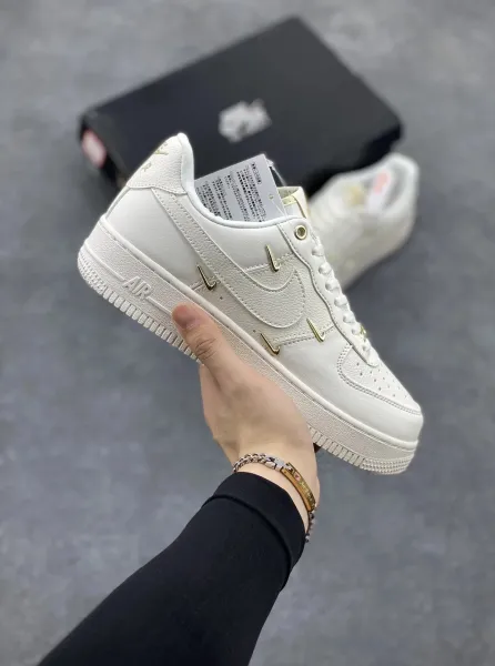 Nike Air Force 1 Low White with Gold Swoosh Hardware Sneakers - 1