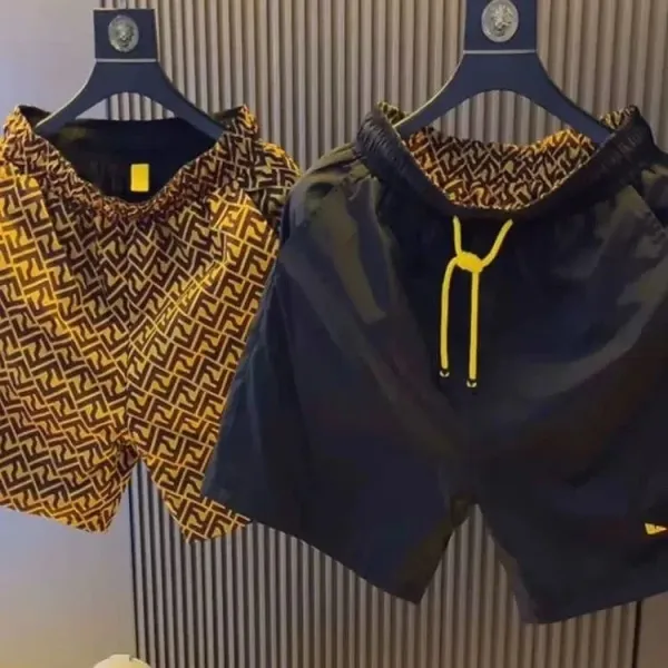 Fendi FF Logo Print Swim Shorts in Yellow and Black - 1
