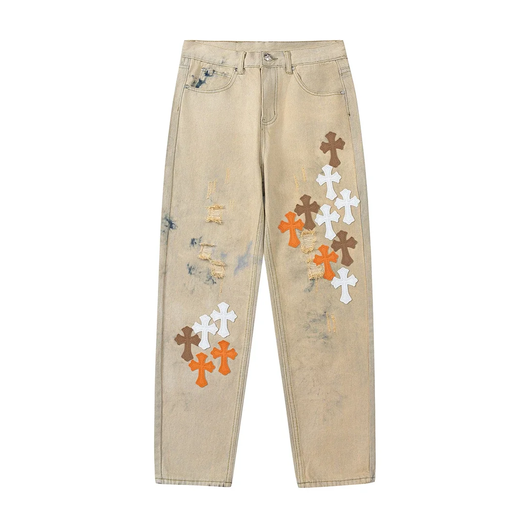 Chrome Hearts — Straight-Leg Jeans with Contrasting Leather Cross Patches, Distressing, Rips, and Yellow Mud Dyeing
