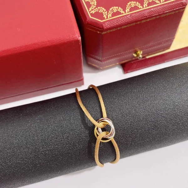 Cartier Trinity Bracelet with Gold Cord Jewelry - 1