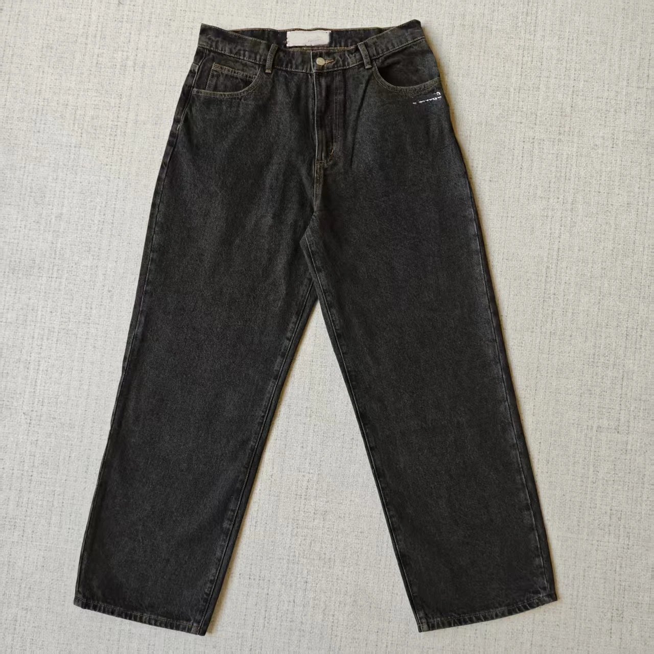 Two characters wearing denim pants