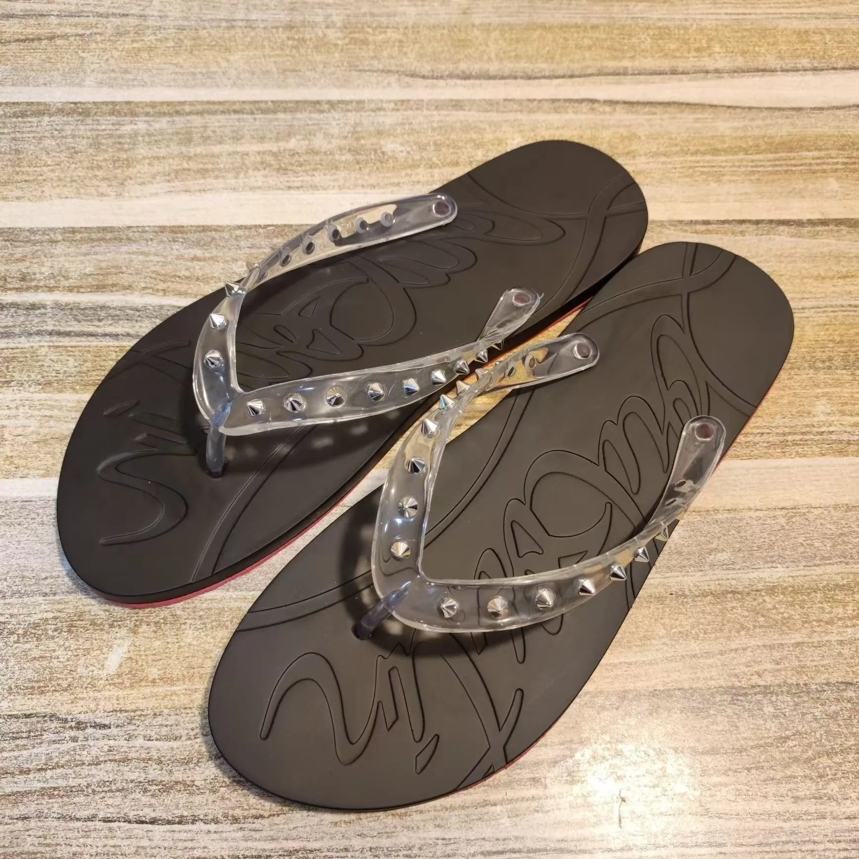 Christian Louboutin Sandals Studded Rubber Slide — Black transparent flip-flops with silver studs