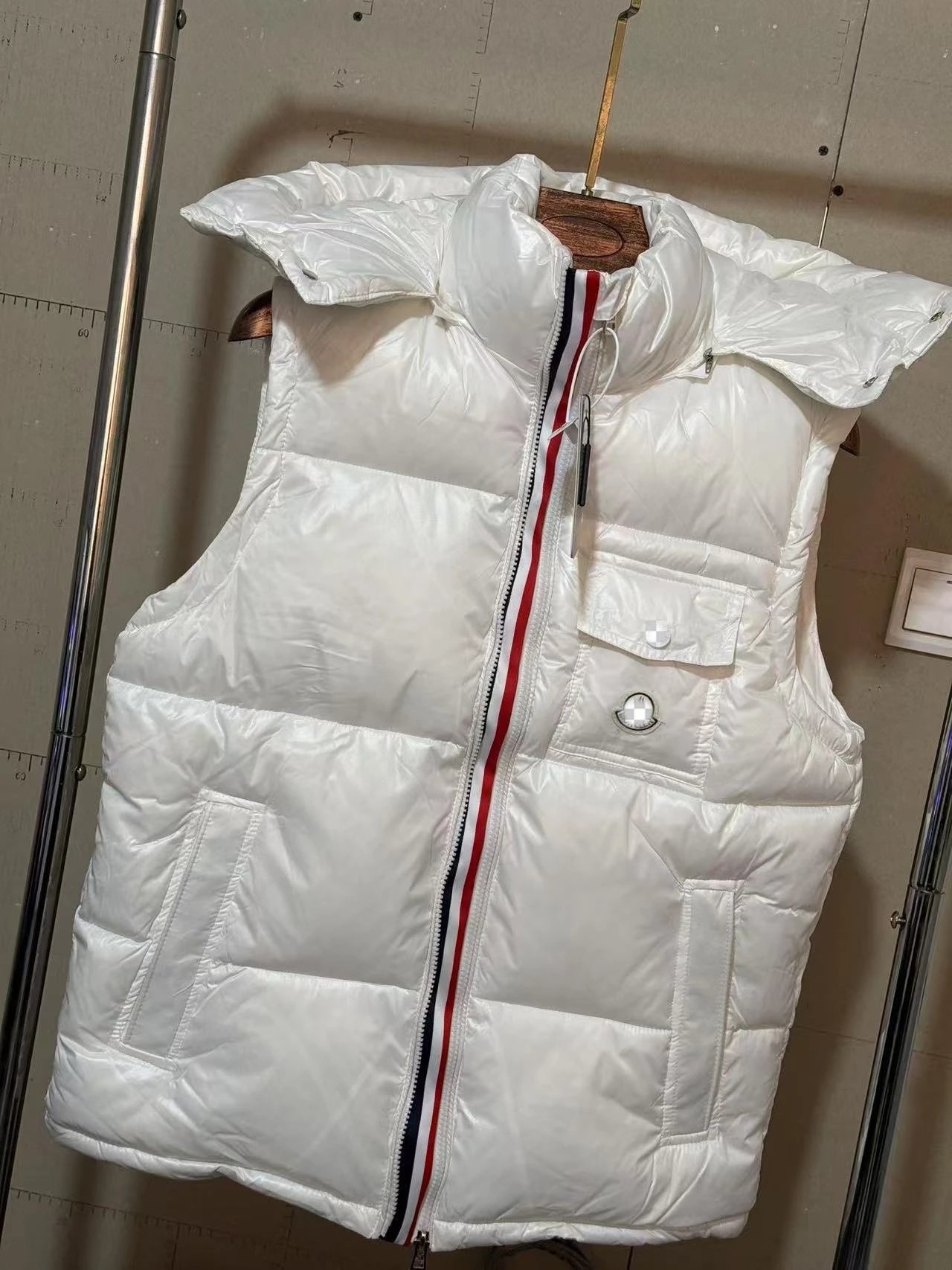 Moncler Vests Glossy quilted stand-collar down vest with contrast-trimmed collar — White