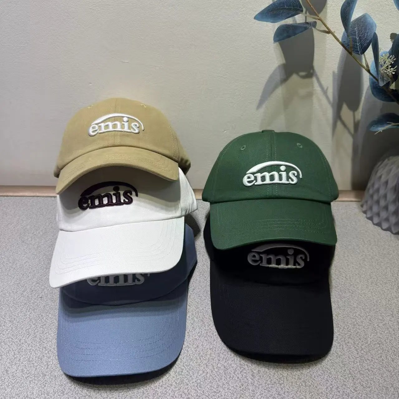 Emis Baseball Caps in Beige, White, Green, Black, and Blue