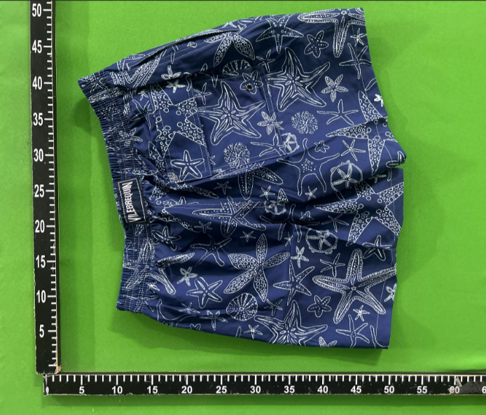 Swimming trunks and beach trunks develop color when exposed to water