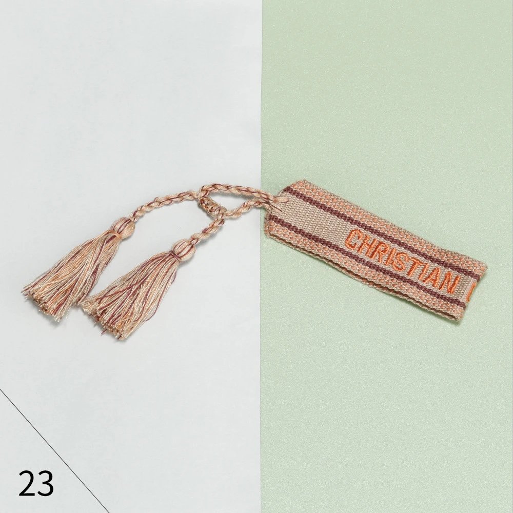 Christian Louboutin Christian Louboutin Tassel Bookmark in Beige & Brown Beige