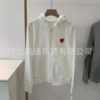 White with a small red heart in front