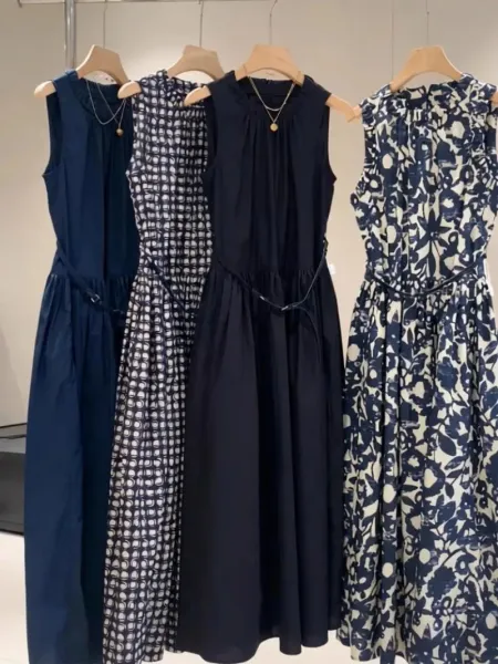 Design Sleeveless Smocked Waist Midi Dress in Navy, Geometric Print, and Floral Print - 1