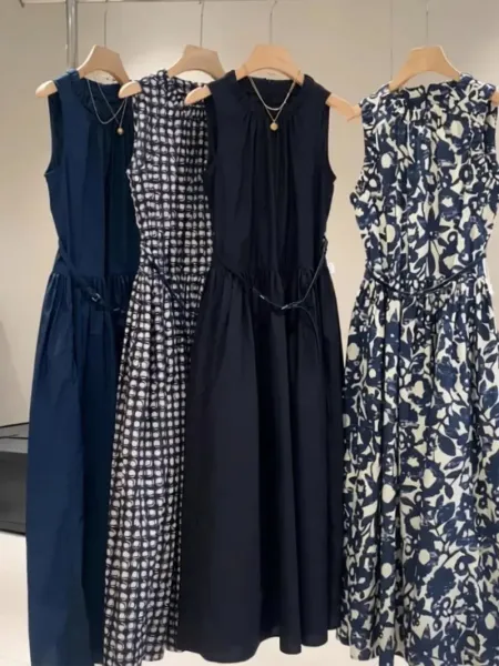 Design Sleeveless Smocked Waist Midi Dress in Navy, Geometric Print, Solid Black, and Floral Print - 1