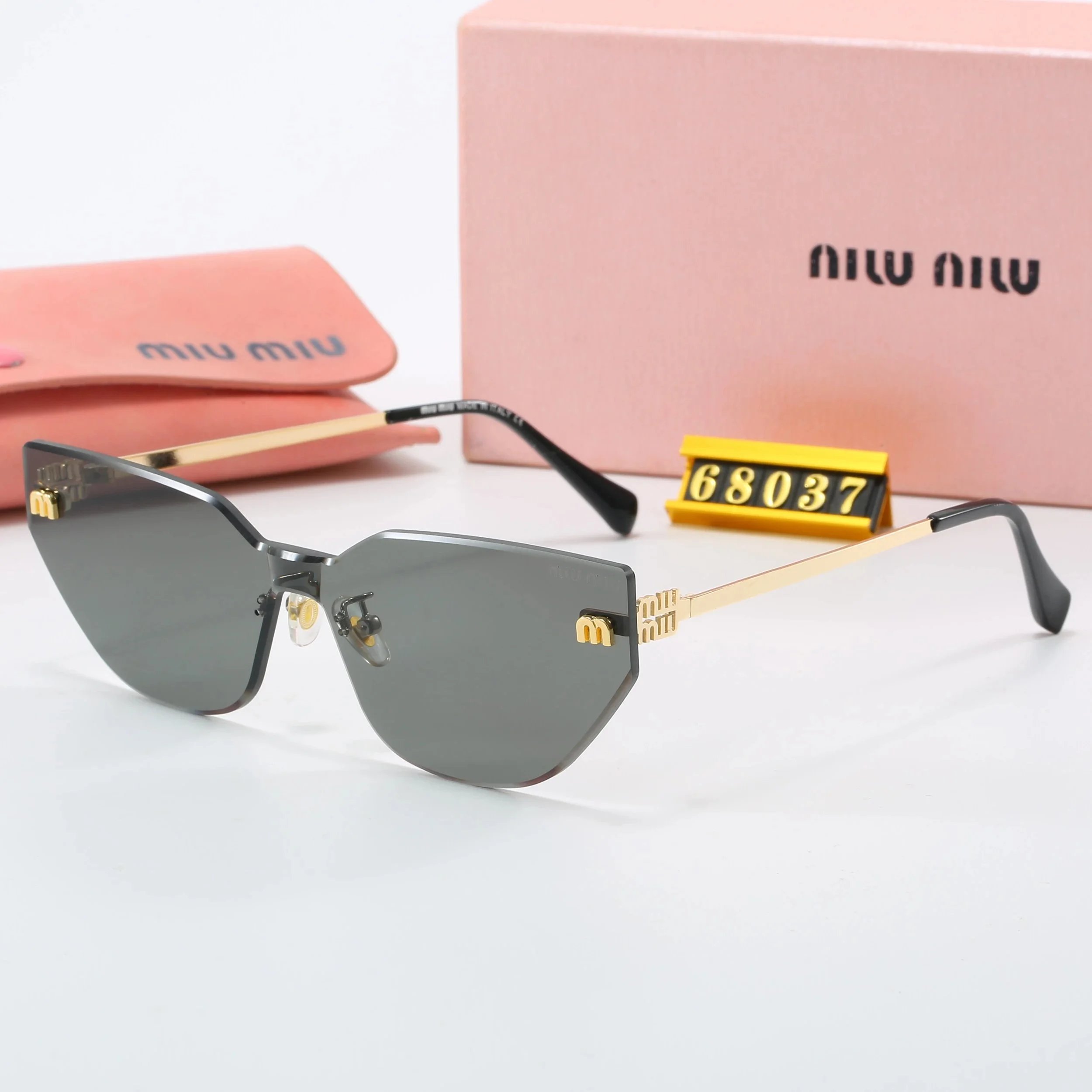 Miu Eyewear Rimless geometric sunglasses with logo temples — 19
