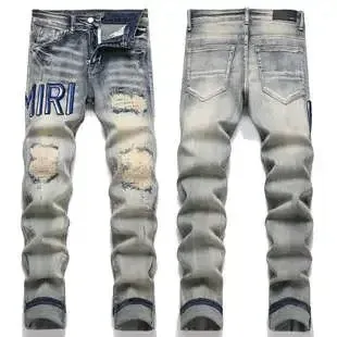 Amiri Distressed Logo Washed Denim Jeans - 1