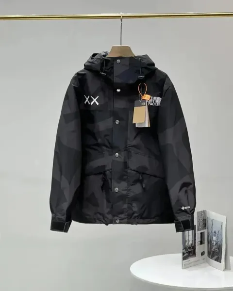 The North Face x KAWS Mountain Light Jacket Black Camo Outerwear - 1