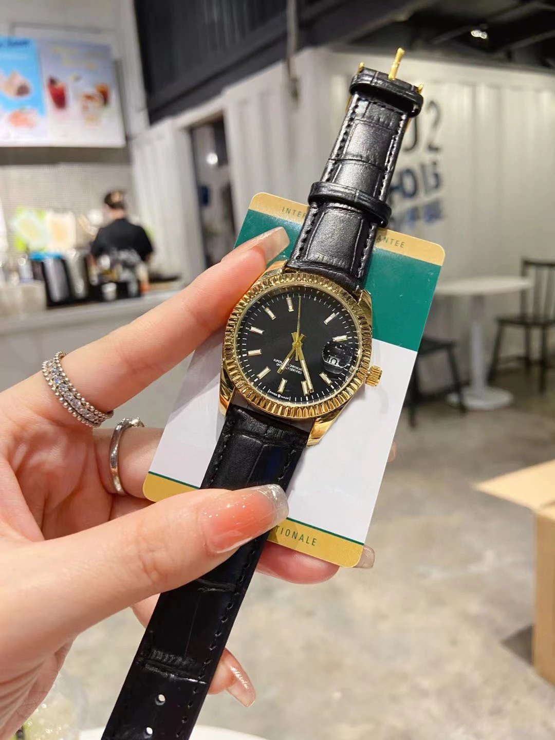 Gold-Toned Watch with Black Leather Strap